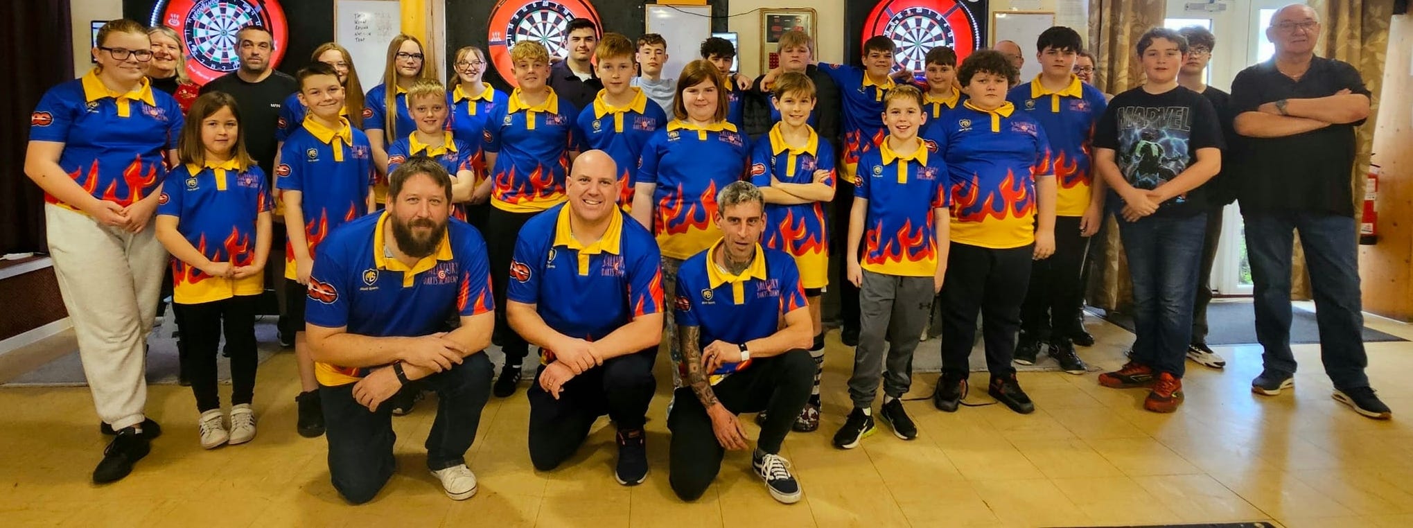 Blackburn Youth darts players enjoying a competitive match