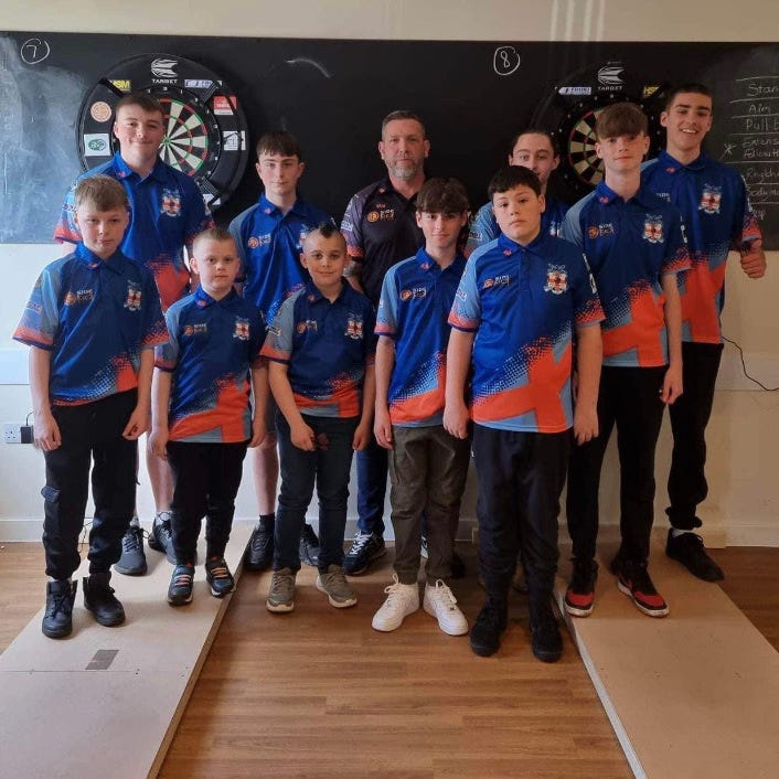 Stowmarket Youth Darts Development School players standing on their oche