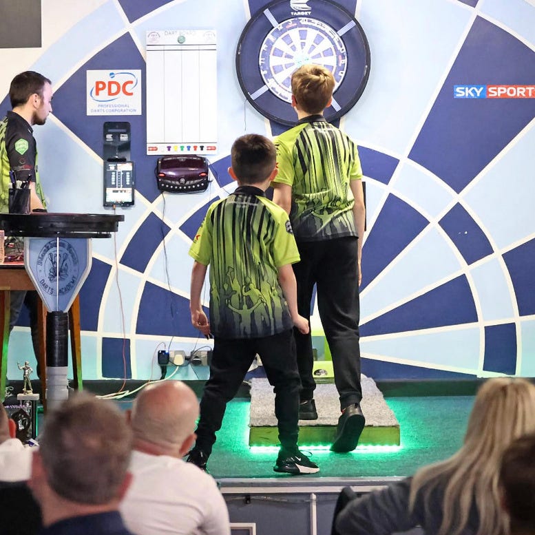 Blackburn Youth darts players enjoying a competitive match