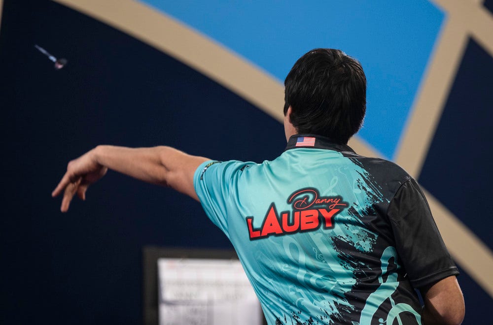 Danny Lauby throwing darts at a dartboard