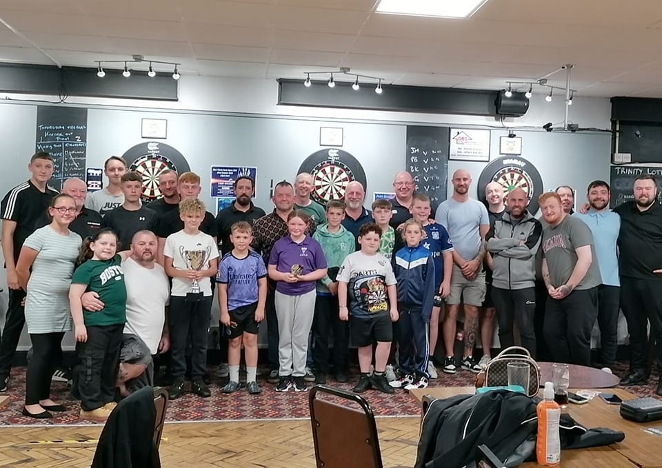 Blackburn Youth darts players enjoying a competitive match