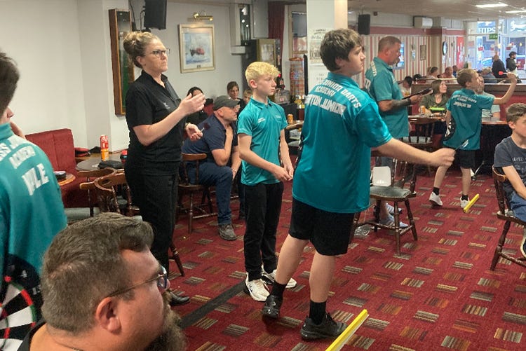 Skegness Junior Darts Academy players enjoying time on the oche.