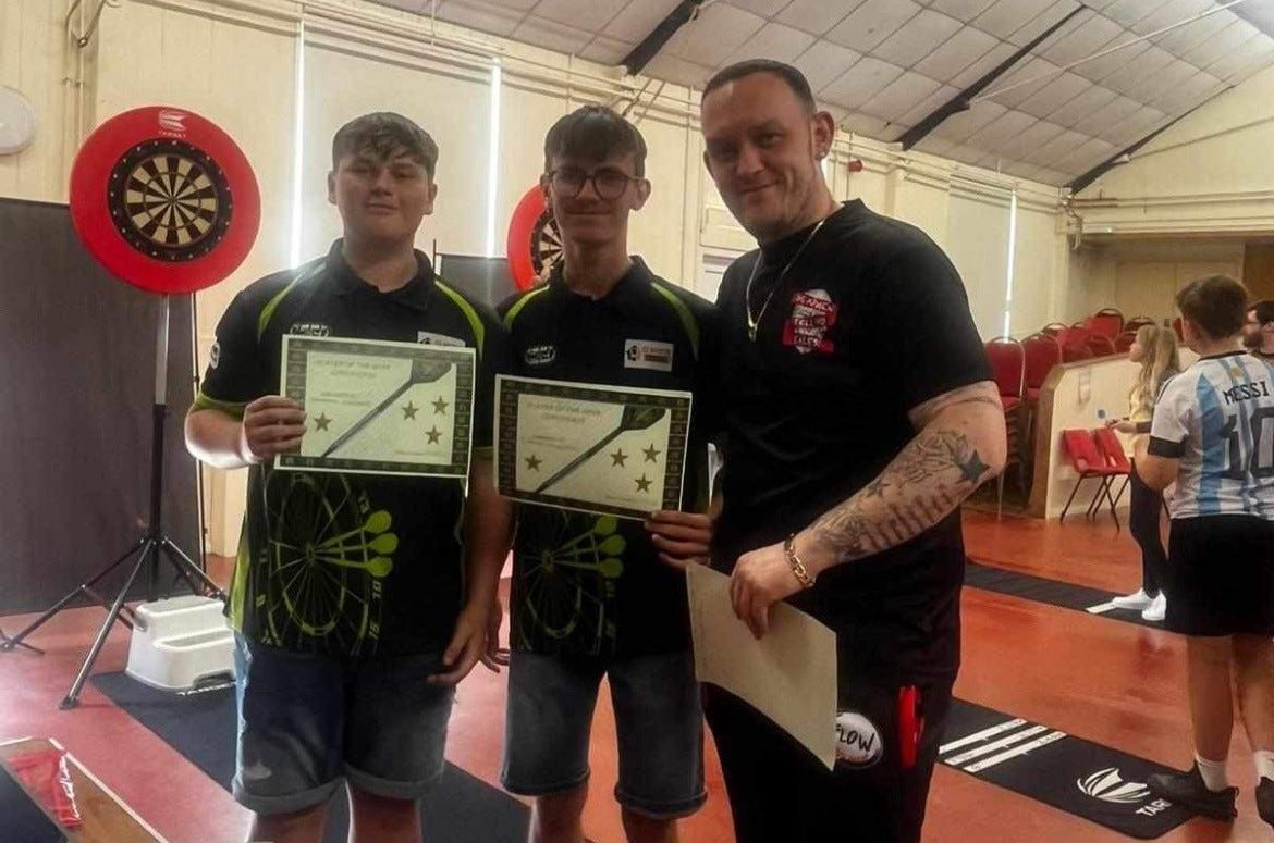 Cefn Cribwr Darts Academy players receiving certificates
