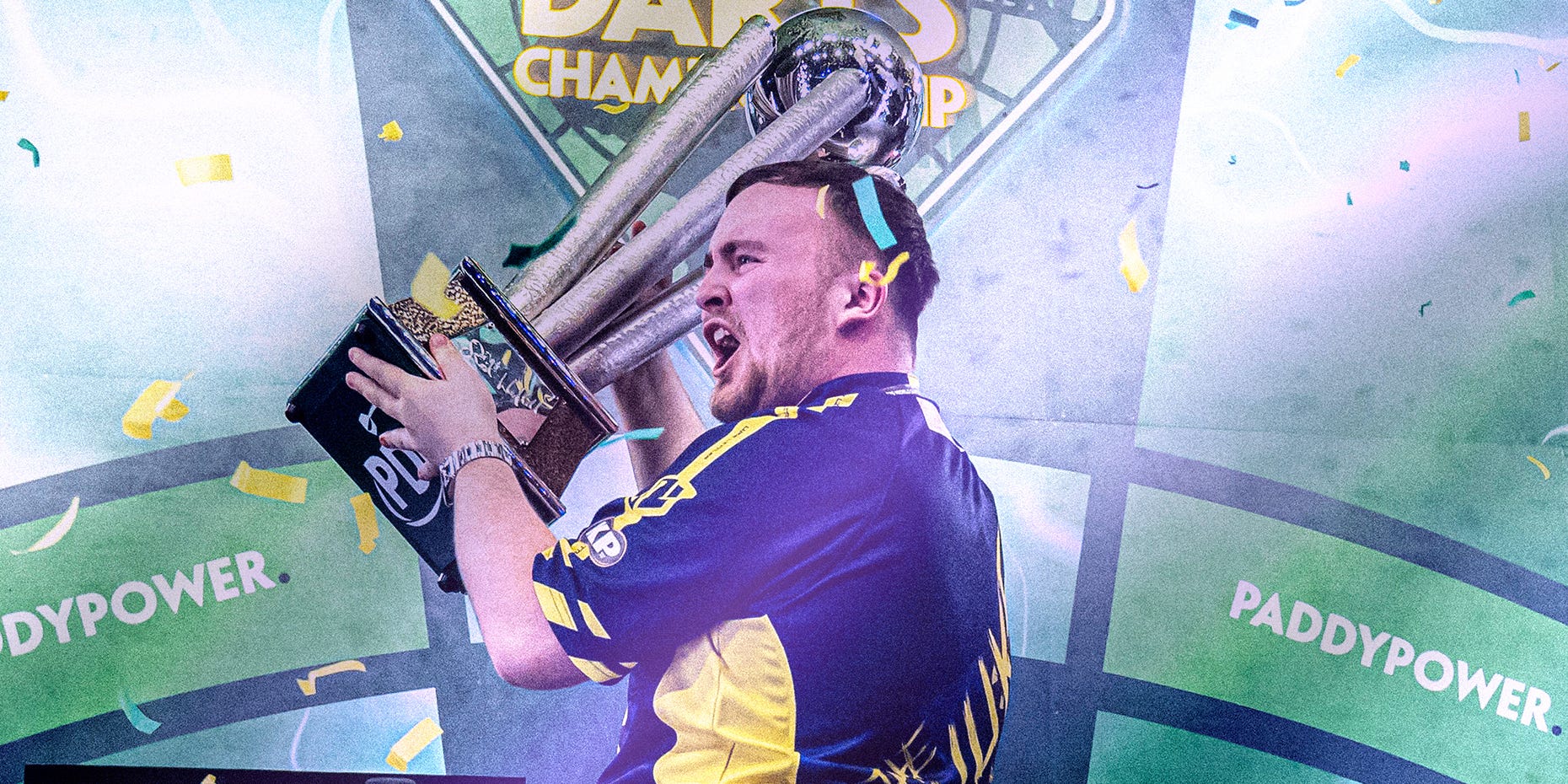 Luke Littler lifting the 2025 World Darts Championship Trophy