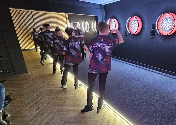 Blackburn Youth darts players enjoying a competitive match
