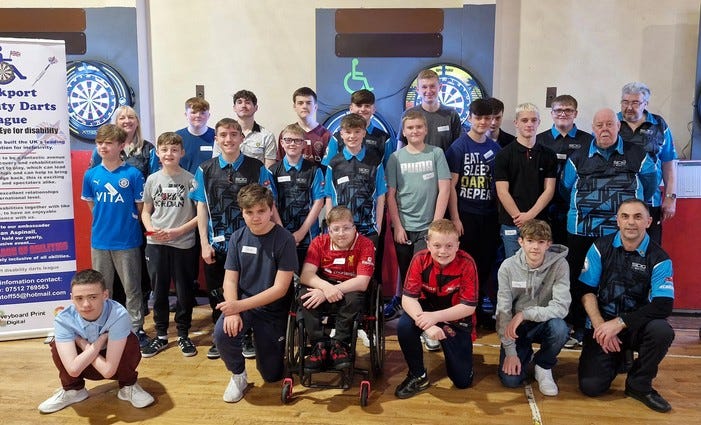 Blackburn Youth darts players enjoying a competitive match
